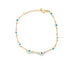 A delicate gold link bracelet features blue and white enamel evil eye charms spaced evenly around the chain against a white background.