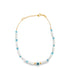 A delicate gold chain bracelet features alternating white and turquoise beads with a central evil eye charm.