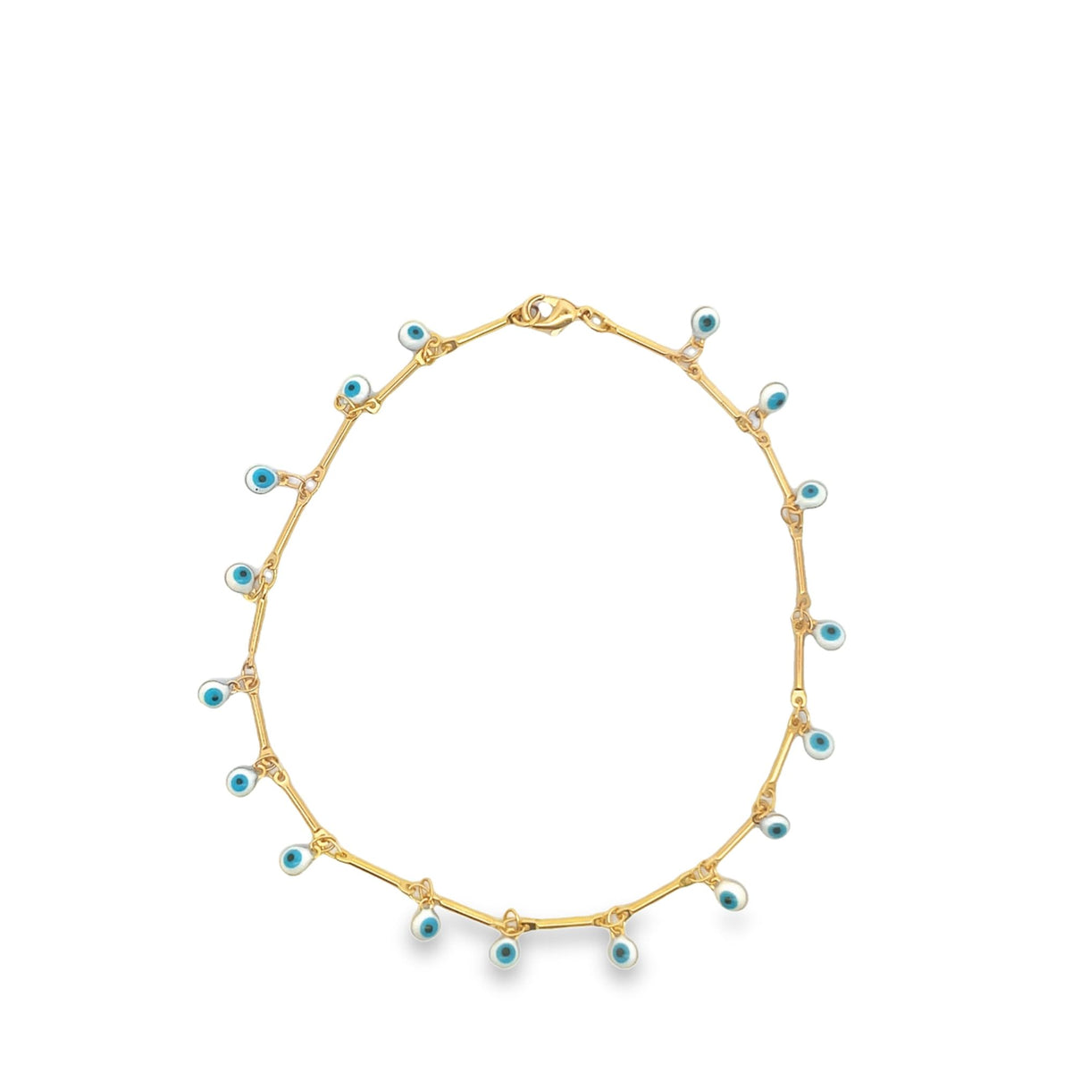 A delicate gold chain necklace dangles blue and white evil eye charms against a clean white background.