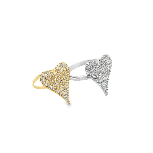 Two pavé-set diamond heart rings, one in yellow gold and the other in silver, rest side-by-side against a clean white background.
