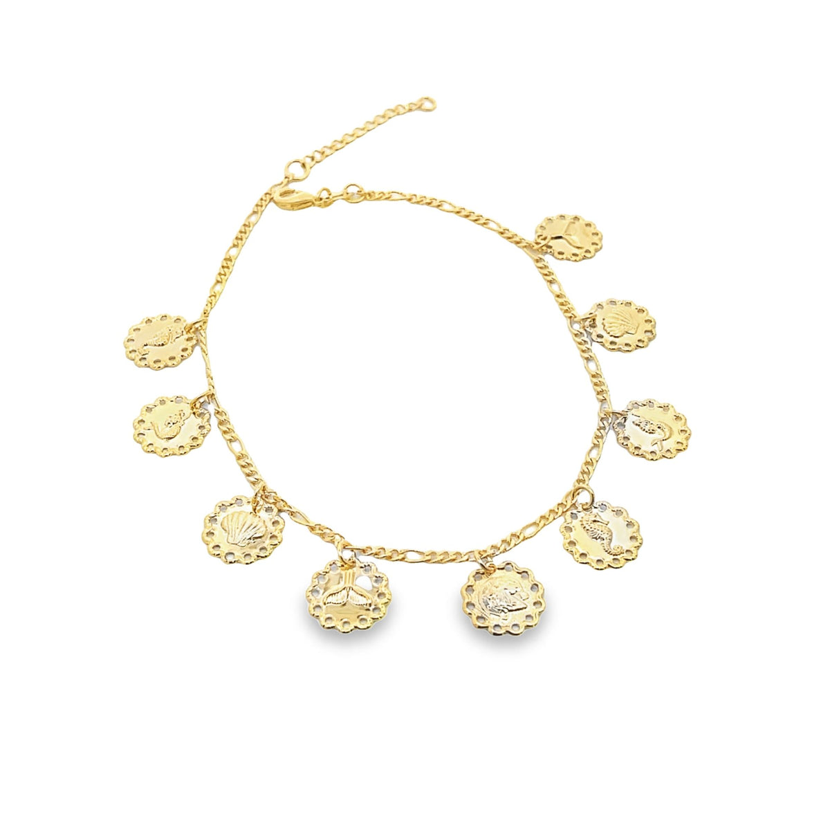 A delicate gold charm bracelet displays hanging medallions featuring various nautical motifs.