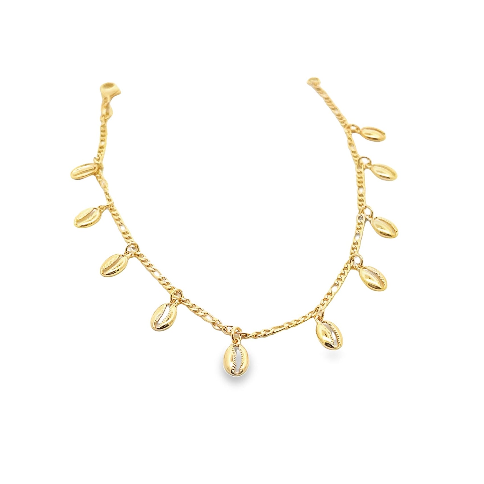 A delicate gold charm anklet features dangling cowrie shell charms against a clean white background.