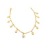A delicate gold chain bracelet features hanging cowrie shell charms against a clean white background.