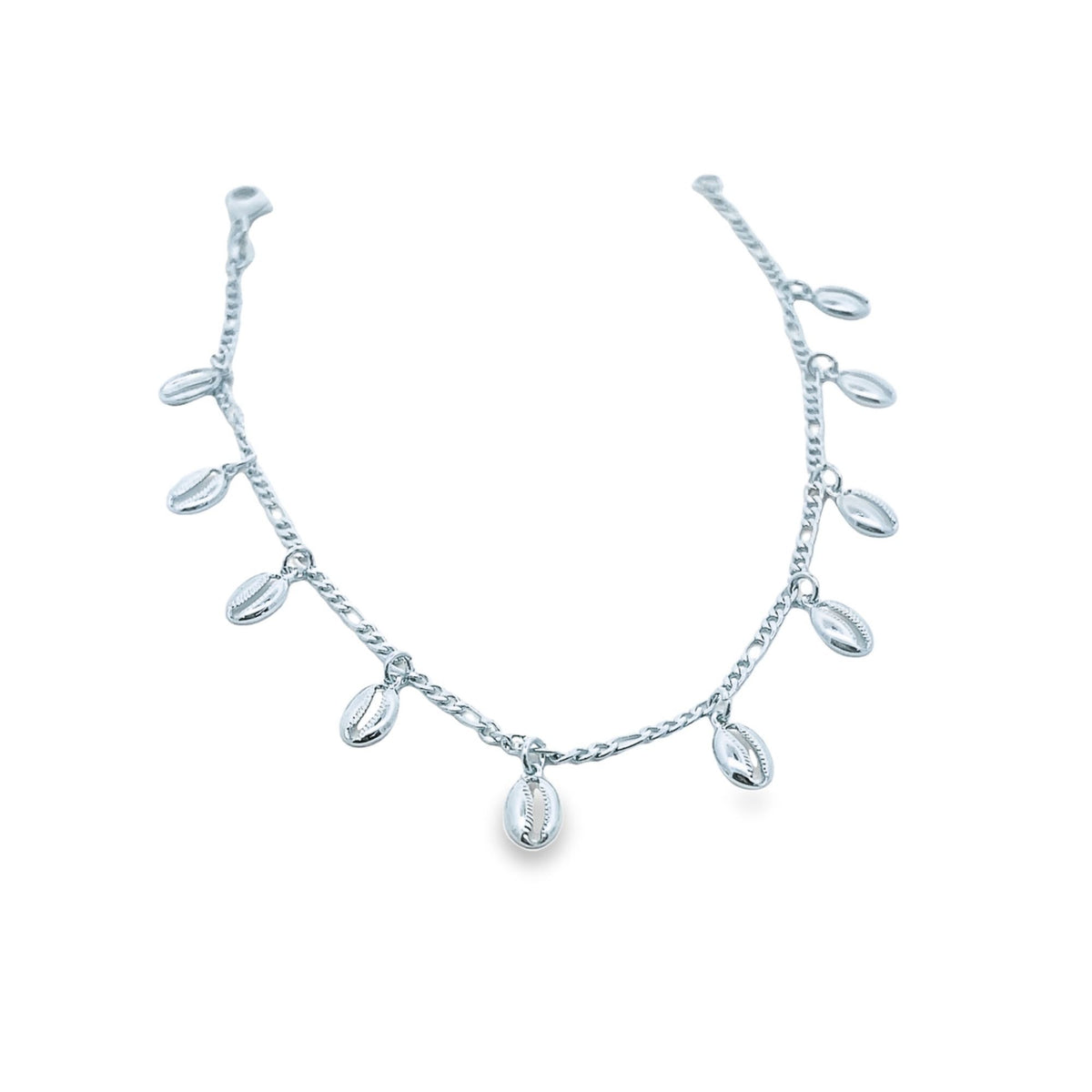 A delicate silver anklet features dangling shell charms against a clean white background.