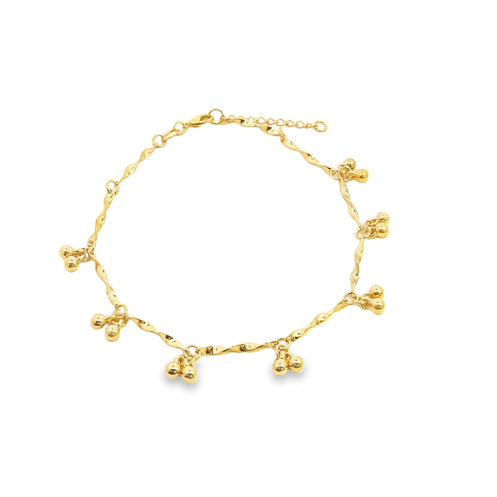 A shiny gold anklet features a twisted chain adorned with delicate hanging bell charms.