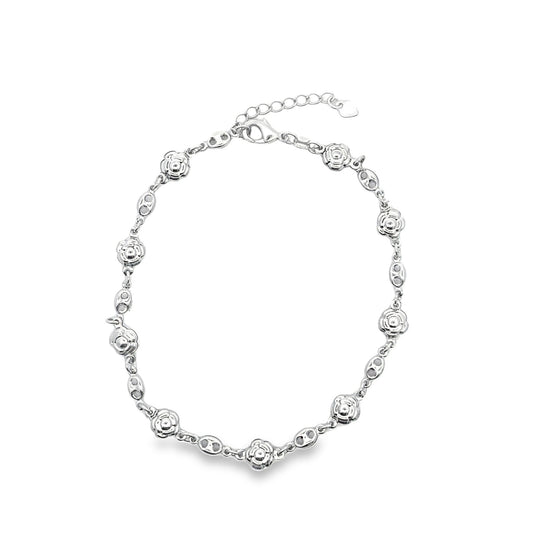 A silver floral bracelet featuring alternating rose charms and interlocking chain links rests against a clean white background.