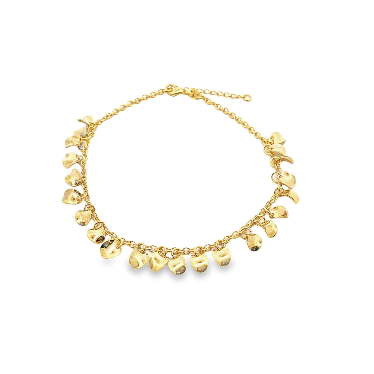 A delicate gold charm anklet features small, curved dangling pendants along a fine chain.