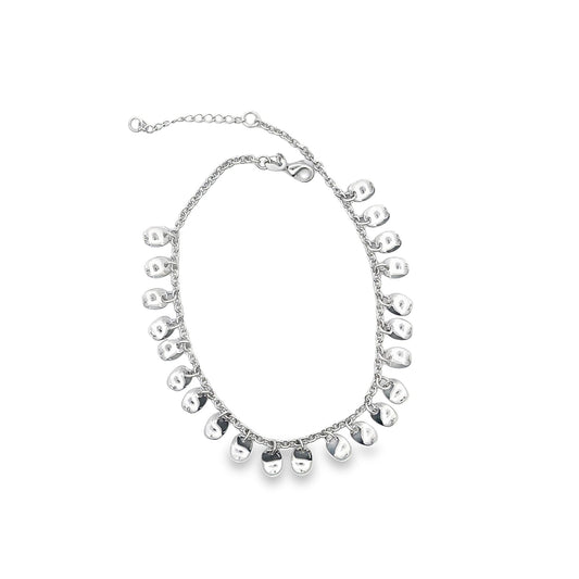 A delicate silver charm bracelet featuring numerous dangling metallic pebble charms is displayed against a clean white background.