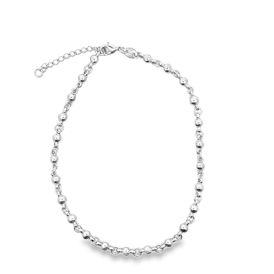 A sterling silver ball chain necklace rests gracefully against a clean white background.