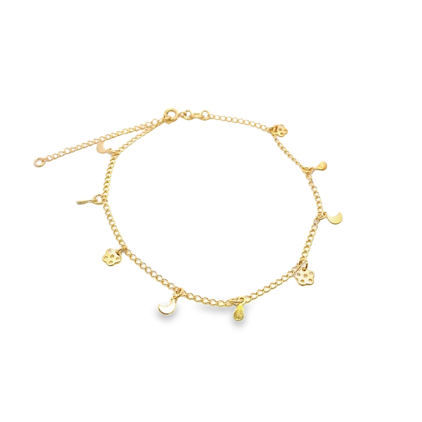 A delicate gold charm anklet displays dangling charms including crescent moons, flowers, and teardrops against a plain white background.