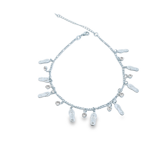 A delicate silver charm anklet features dangling flip-flop charms and sparkling crystal rhinestones against a clean white background.
