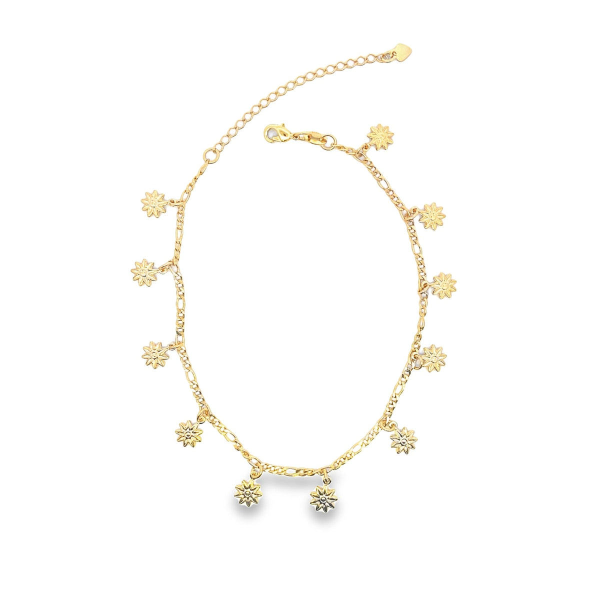 A delicate gold charm anklet displays sparkling sun-shaped pendants along its chain against a clean white background.