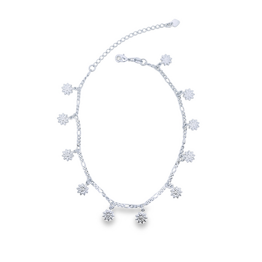 A delicate silver anklet features dangling star-shaped charms against a clean white background.
