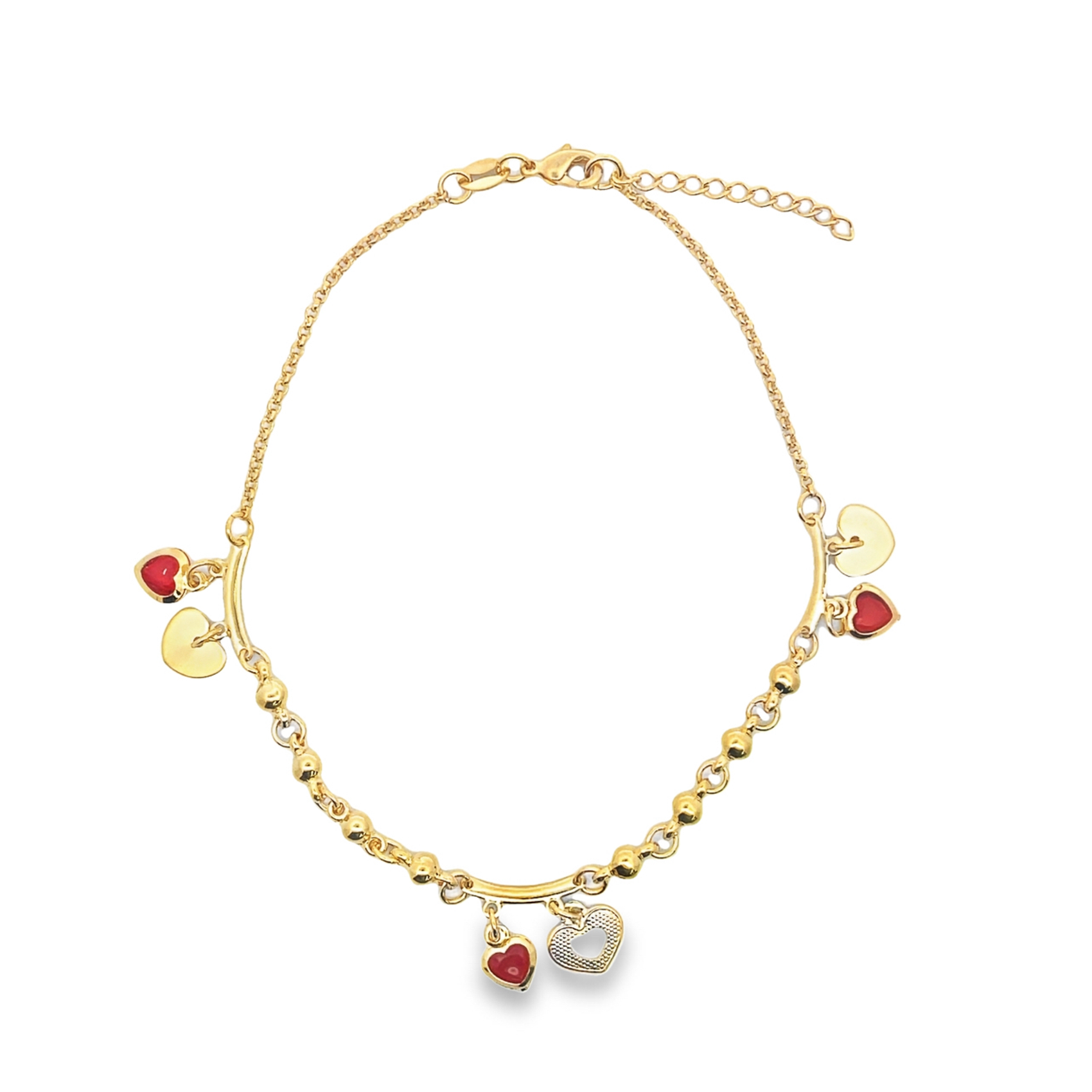 A delicate gold charm necklace sparkles against a white background, featuring dangling red and gold heart pendants.