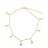 A delicate gold anklet features multiple teardrop-shaped charms encrusted with sparkling diamonds, laid out against a clean white background.