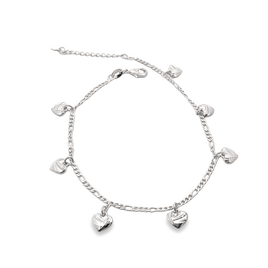 A delicate silver anklet adorned with dangling heart charms rests against a clean white background.
