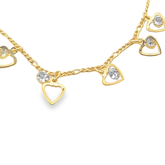 A delicate gold charm bracelet features dangling open-heart pendants accented with sparkling rhinestones against a clean white background.