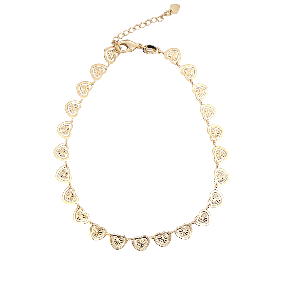 A delicate gold heart link chain bracelet lies displayed against a clean white background.