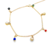 A delicate gold chain anklet dangles colorful evil eye beads and shiny metallic charms against a clean white background.