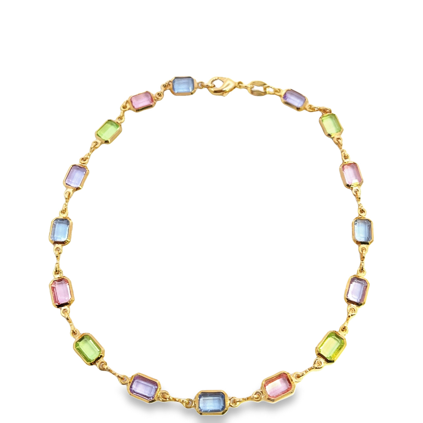 A gold chain necklace displays a repeating pattern of rectangular pastel gemstone crystals in shades of blue, green, pink, and purple.