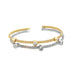 An elegant two-tone cuff bracelet features woven gold and silver strands accented with sparkling bezel-set diamonds.