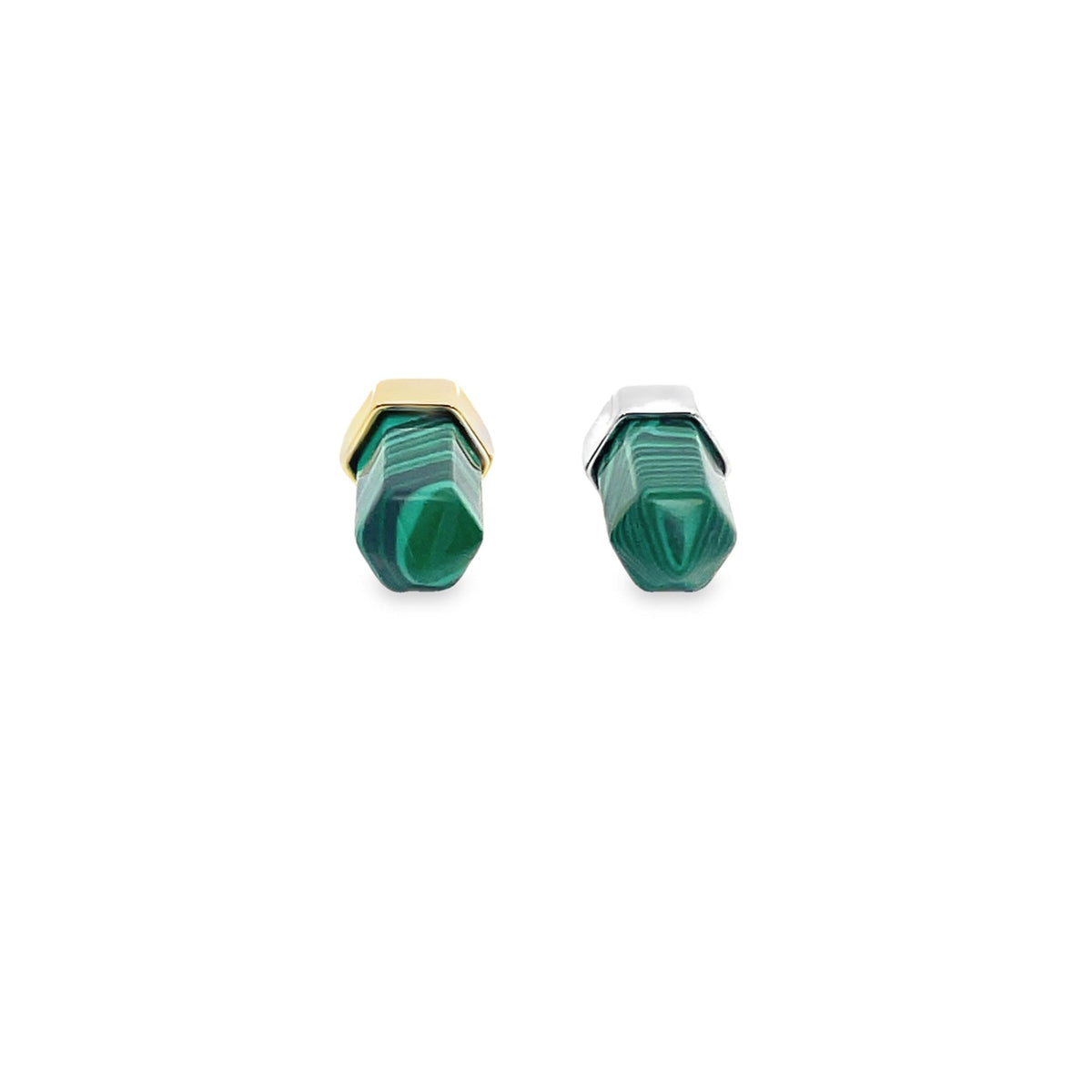 Two hexagonal malachite crystal gemstone stud earrings, one capped in gold and the other in silver, rest side by side on a white background.