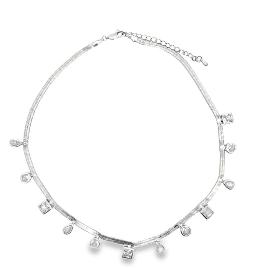 A silver herringbone choker necklace features dangling charms in round, square, and teardrop zirconia stone shapes against a clean white background.