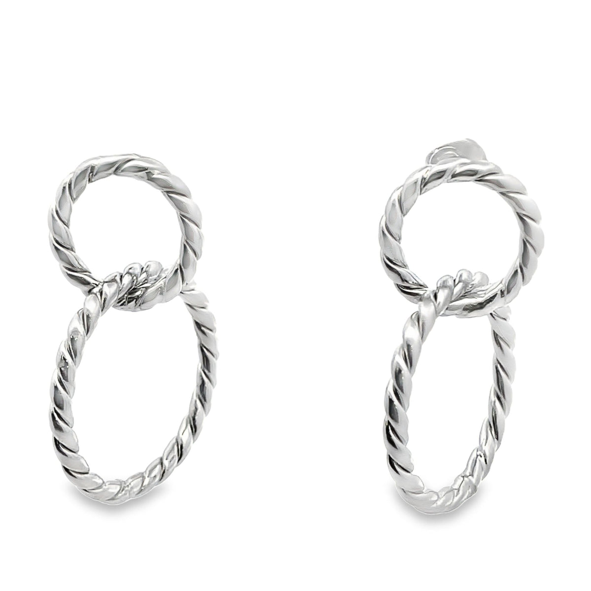 A pair of silver twisted rope double hoop earrings showcases interlocking circles on a white background.