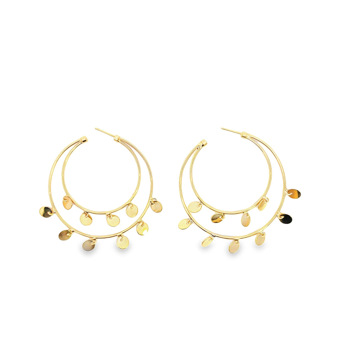 A pair of double-hoop gold earrings features delicate dangling coin charms against a white background.