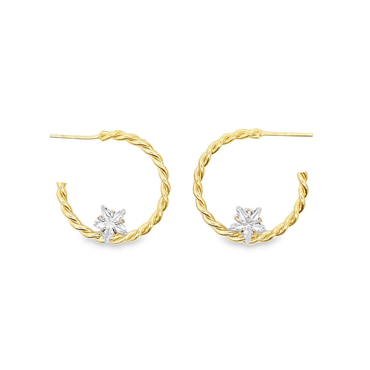 A pair of twisted gold hoop earrings feature sparkling diamond star charms centered along the bottom.