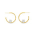 A pair of twisted gold hoop earrings feature sparkling diamond star charms centered along the bottom.