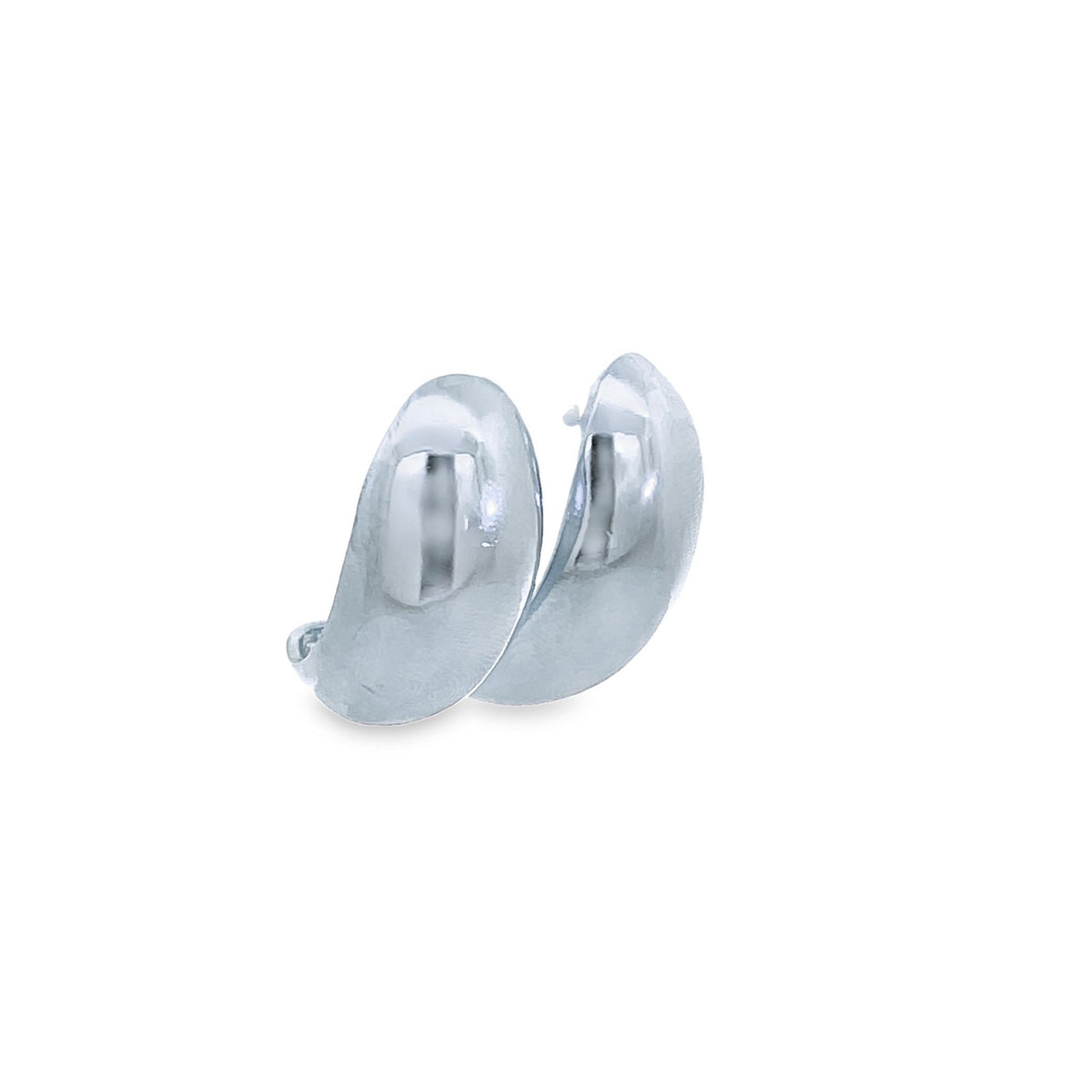 A pair of polished silver chunky huggie hoop earrings rests against a clean white background.