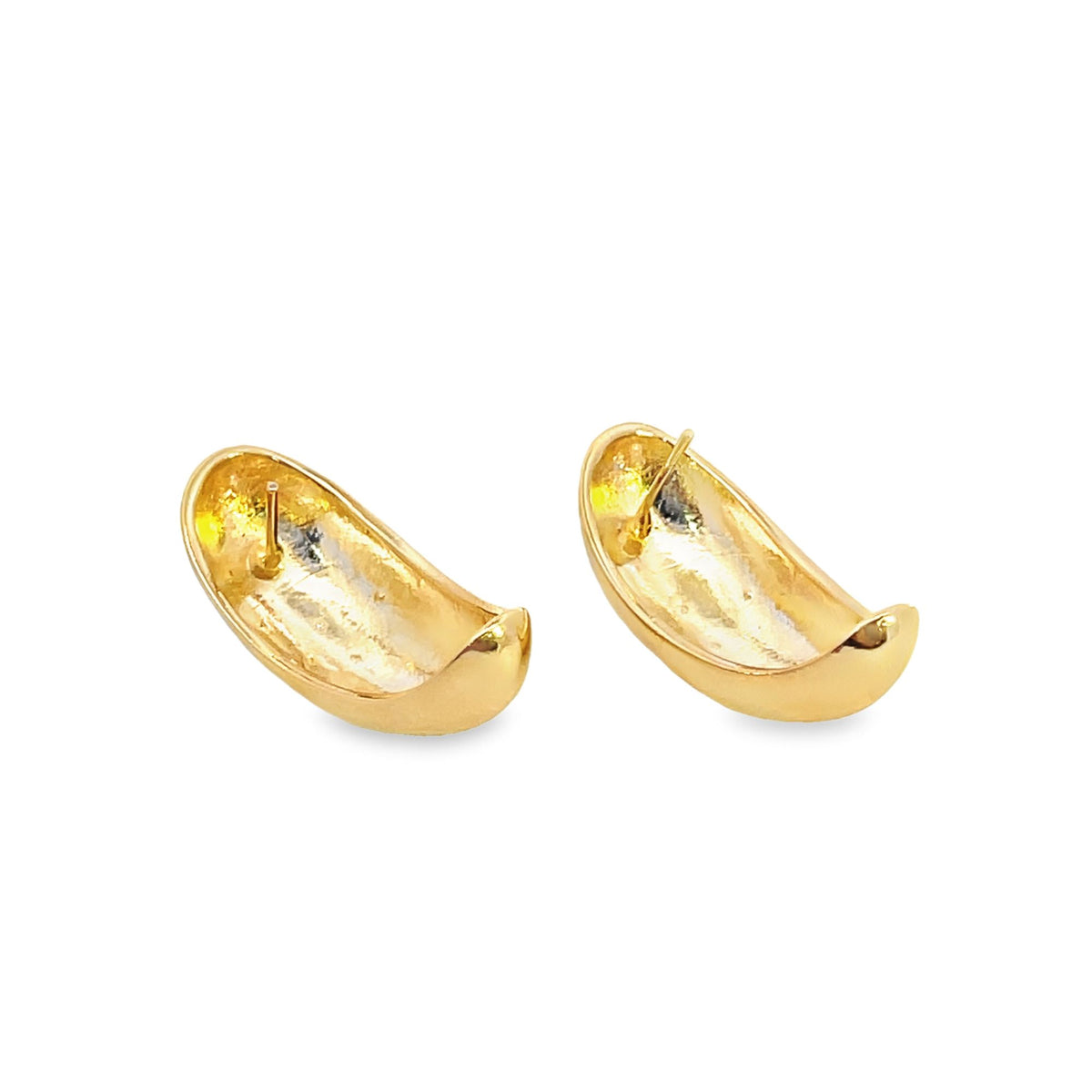 A pair of thick gold dome hoop earrings rest side by side against a clean white background, showcasing their smooth, curved backs and secure post closures.