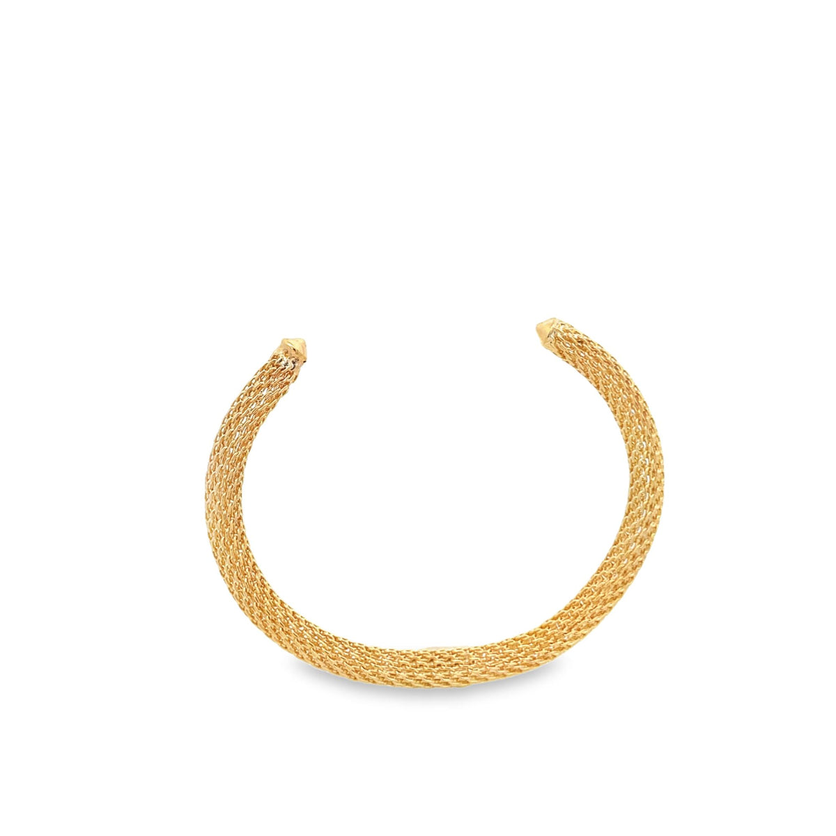 A gold mesh cuff bracelet rests against a clean white background.