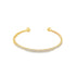 A delicate gold cuff bracelet sparkles with a continuous row of small diamonds and features rounded ball ends against a plain white background.