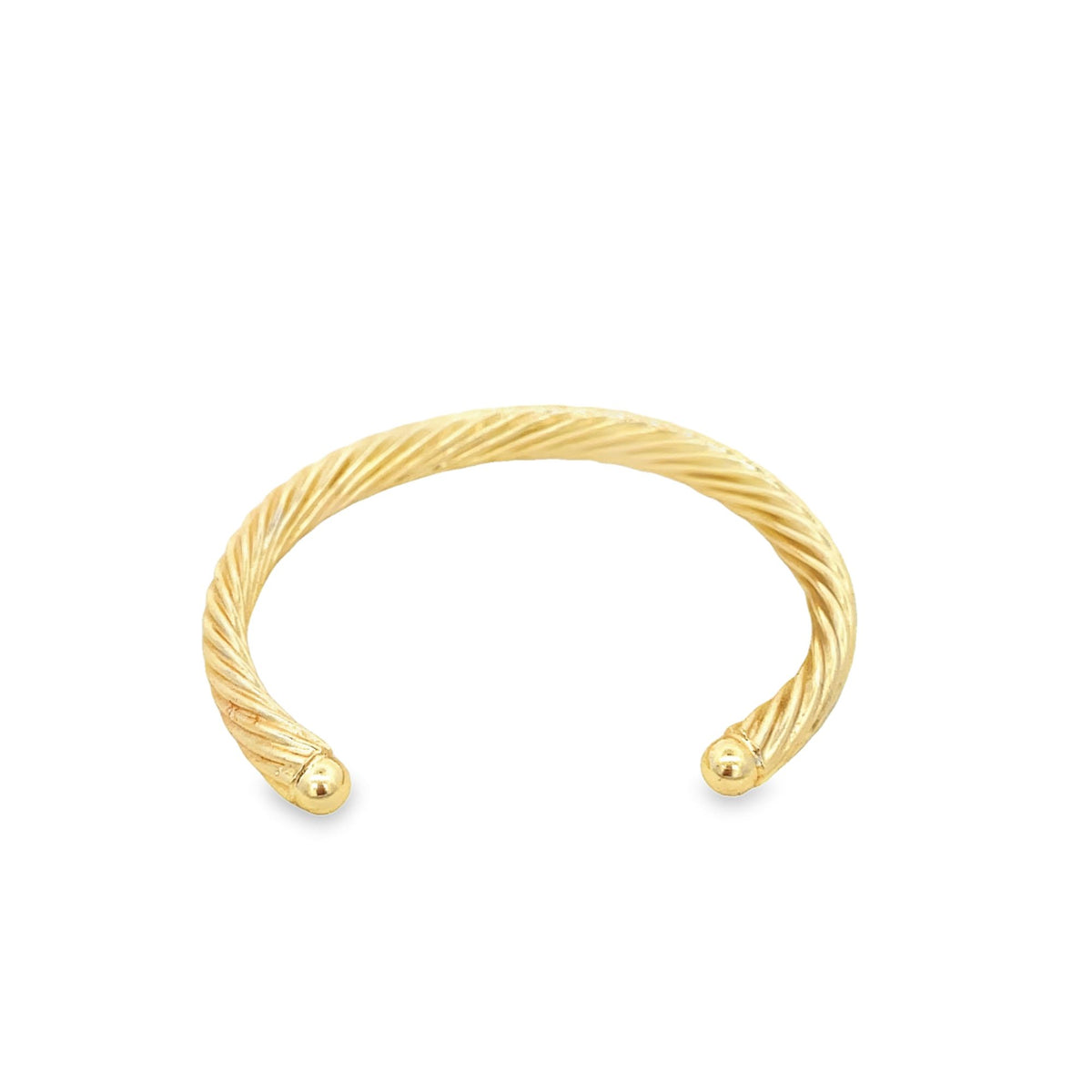 A gold twisted wire cuff bracelet features polished ball ends against a clean white background.