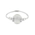 A silver hinged bangle bracelet features a large central white pearl flanked by ornate geometric clasps.