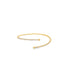 A delicate gold open bangle bracelet sparkles with a continuous line of tiny diamonds and features smooth ball ends.