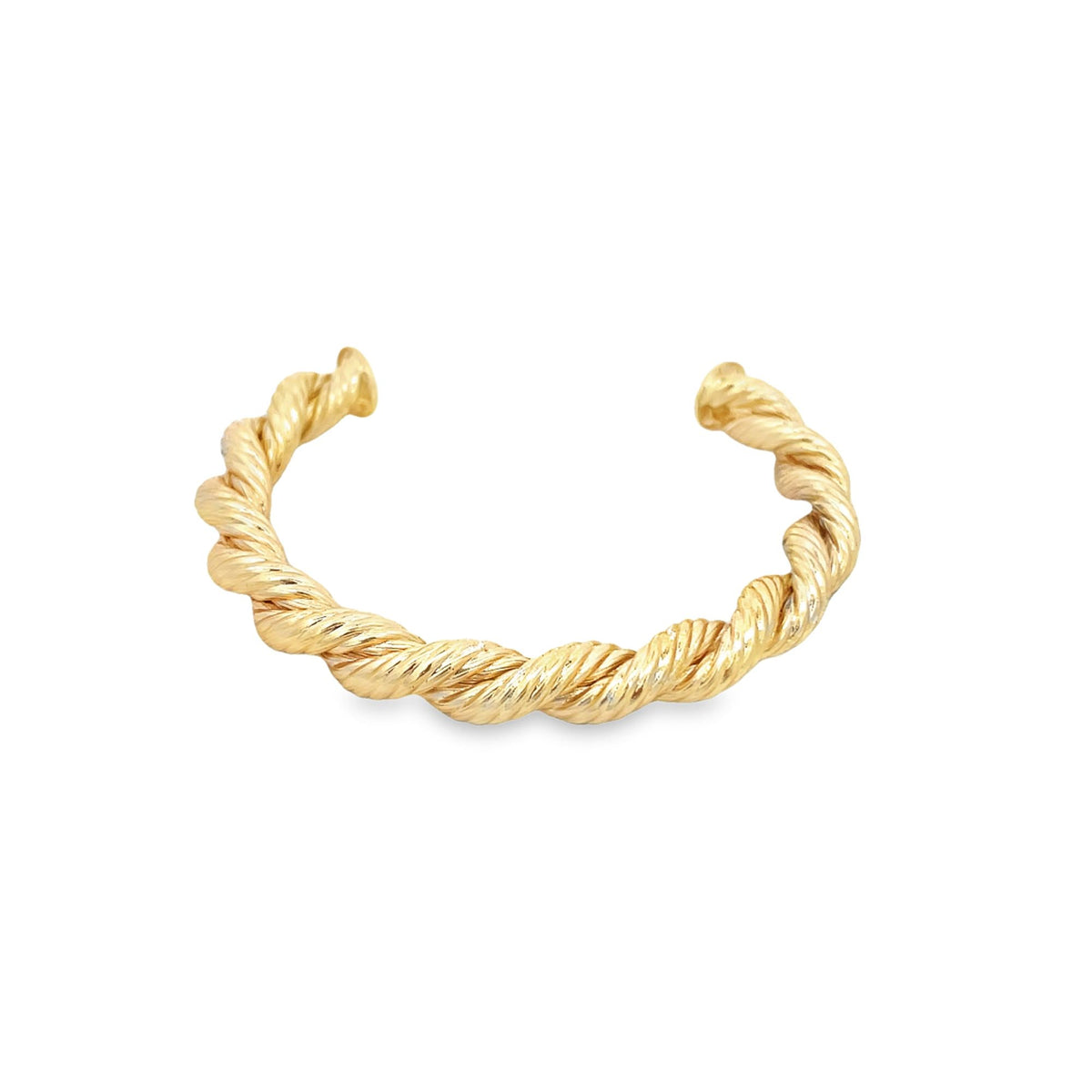 A polished gold cuff bracelet features an intricate twisted rope design against a clean white background.