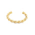 A polished gold cuff bracelet features an intricate twisted rope design against a clean white background.
