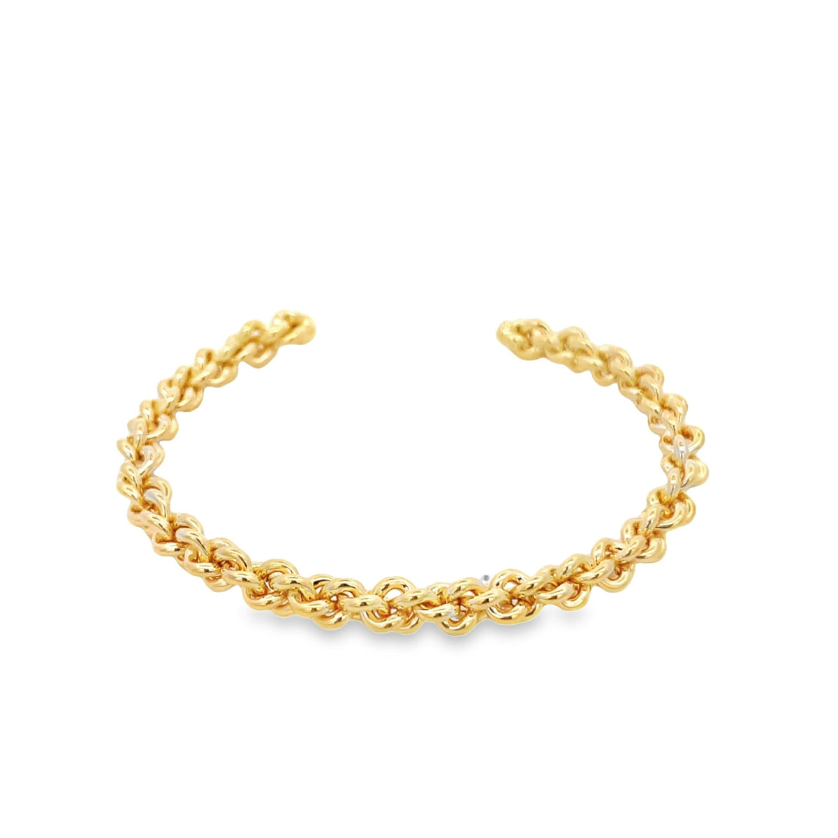 A polished gold cuff bracelet displays an intricate twisted rope design against a clean white background.
