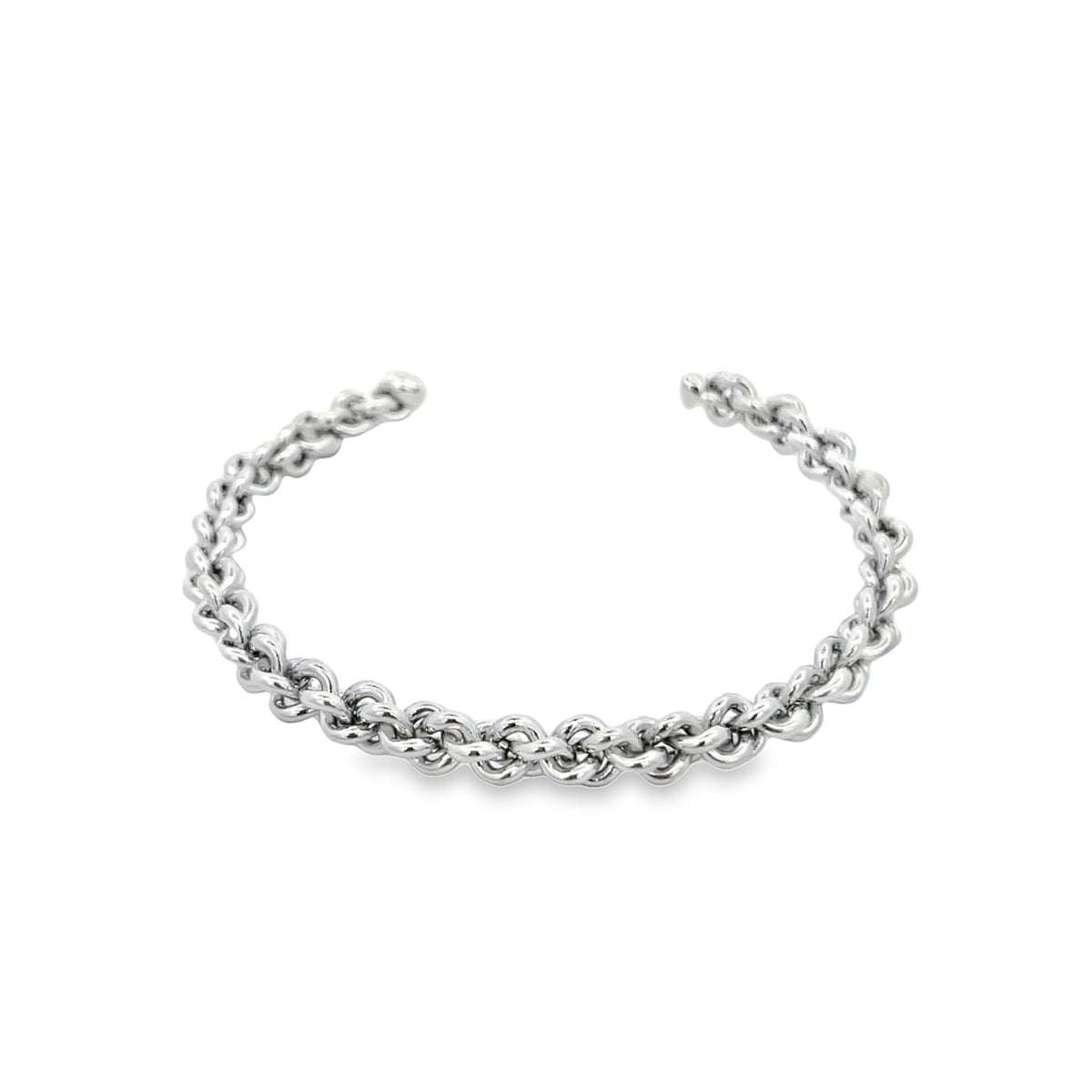 A gleaming silver rope cuff bracelet curves gracefully against a clean white background.