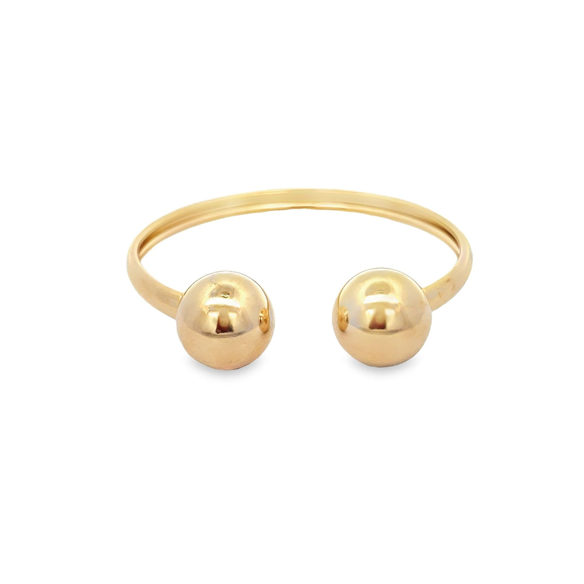 A polished yellow gold cuff bracelet features two matching spherical ball ends on a white background.
