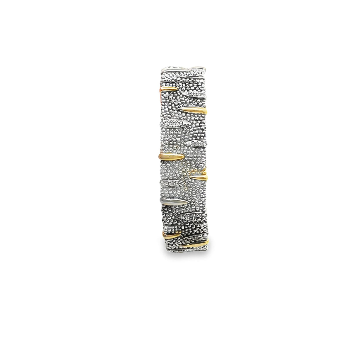 A textured sterling silver band ring features oxidized detailing interspersed with polished gold and diamond accents against a plain white background.