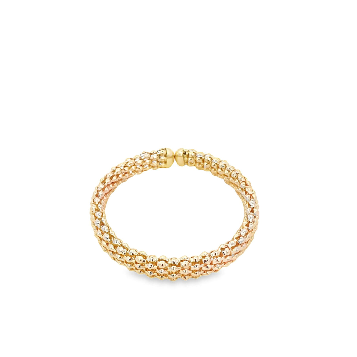 A textured tri-color gold ring glistens against a clean white background.