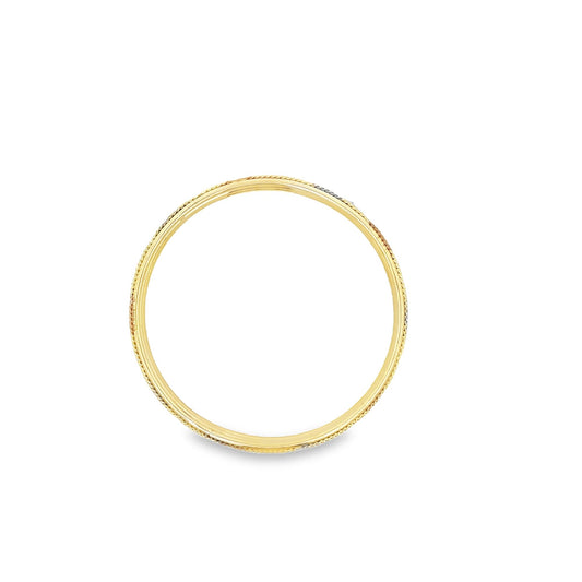 A slim tri-color gold wedding band rests flat against a clean white background, showcasing its interwoven yellow, white, and rose gold strands.