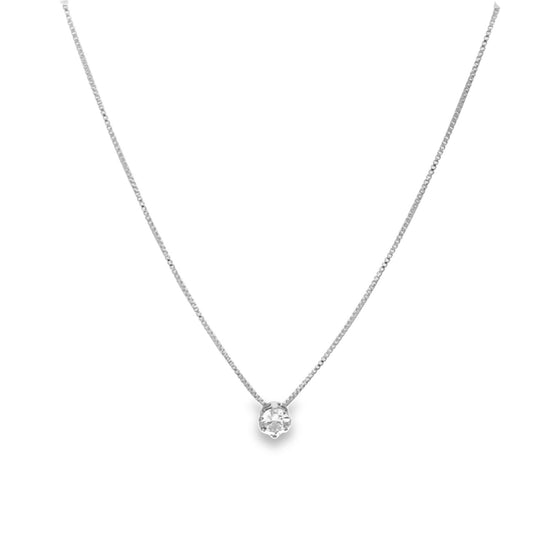 A delicate silver box chain necklace features a sparkling solitaire diamond pendant resting centrally against a plain white background.