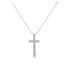 A delicate silver cross pendant embellished with sparkling diamonds hangs from a matching box chain against a white background.