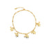 A gold link anklet displays dangling elephant charms against a plain white background.