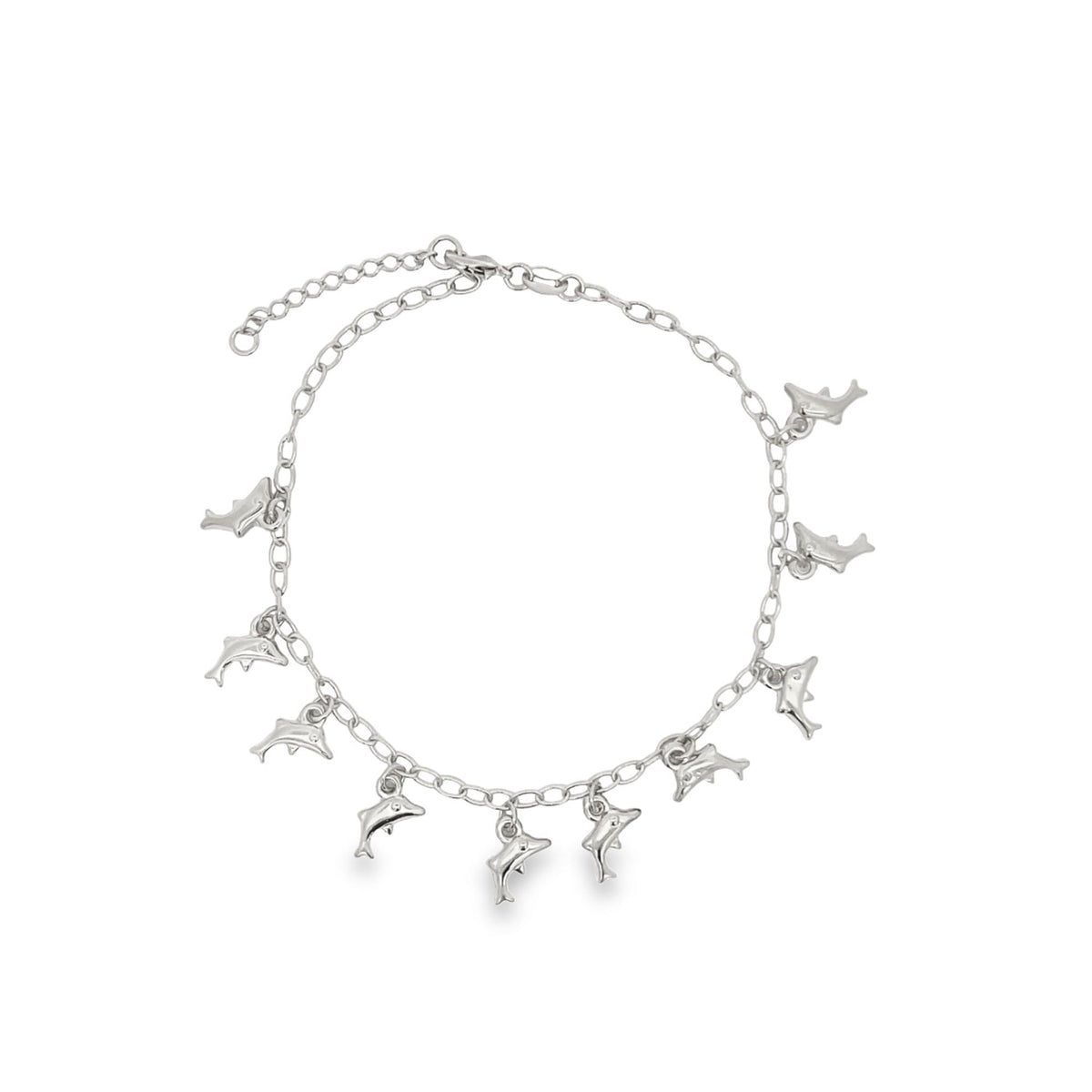 A delicate silver chain anklet features multiple dangling dolphin charms against a clean white background.